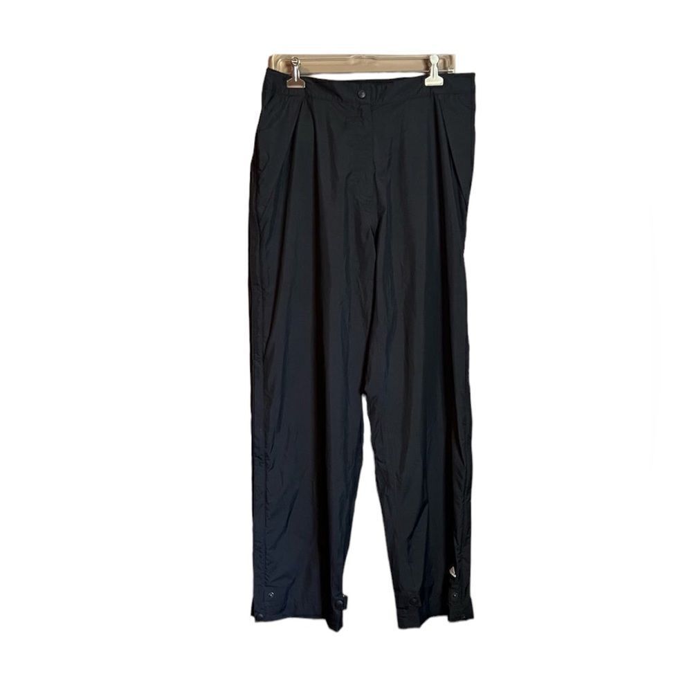 Adidas black track pants with full zip sides. Size large‎